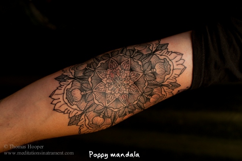 This mandala tattoo has been drawn on the inner part between the arm and the